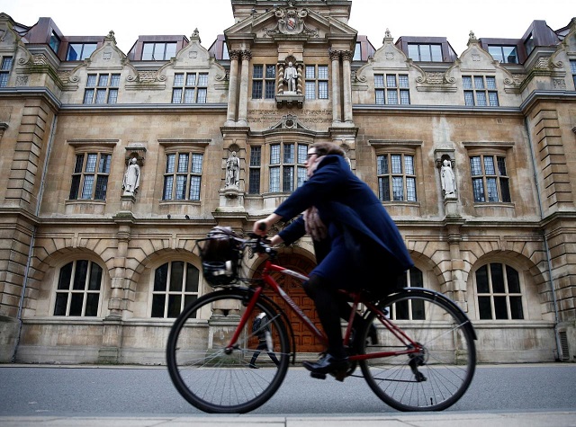 file photo a woman rides a bike next to oriel college in oxford britain december 30 2015 reuters eddie keogh file photo