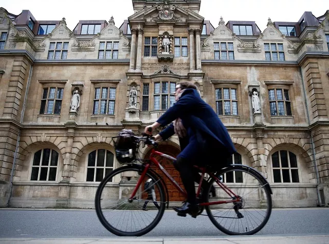 file photo a woman rides a bike next to oriel college in oxford britain december 30 2015 reuters eddie keogh file photo file photo a woman rides a bike next to oriel college in oxford britain december 30 2015 reuters eddie keogh file photo
