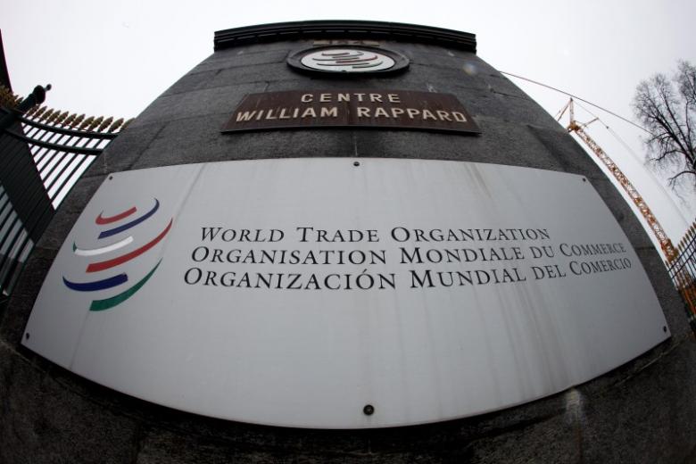 the world trade organization wto logo is seen at the entrance of the wto headquarters in geneva photo reuters