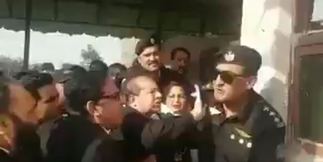 a lawyer is seen slapping a security official deputed outside an accountability court in islamabad on friday october 13 2017 screengrab