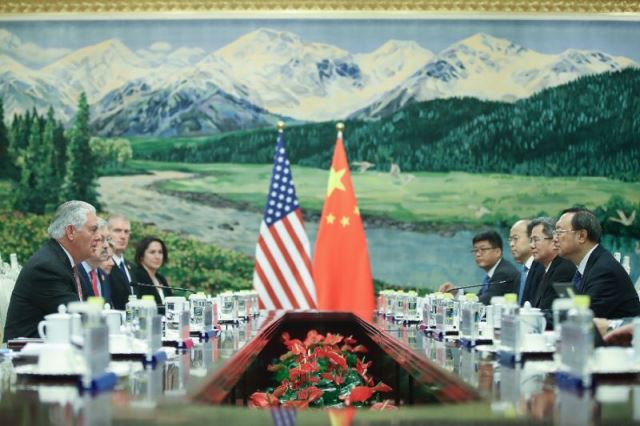 us secretary of state rex tillerson l attends a meeting with chinese state councilor yang jiechi r at the great hall of the people in beijing on september 30 2017 photo afp