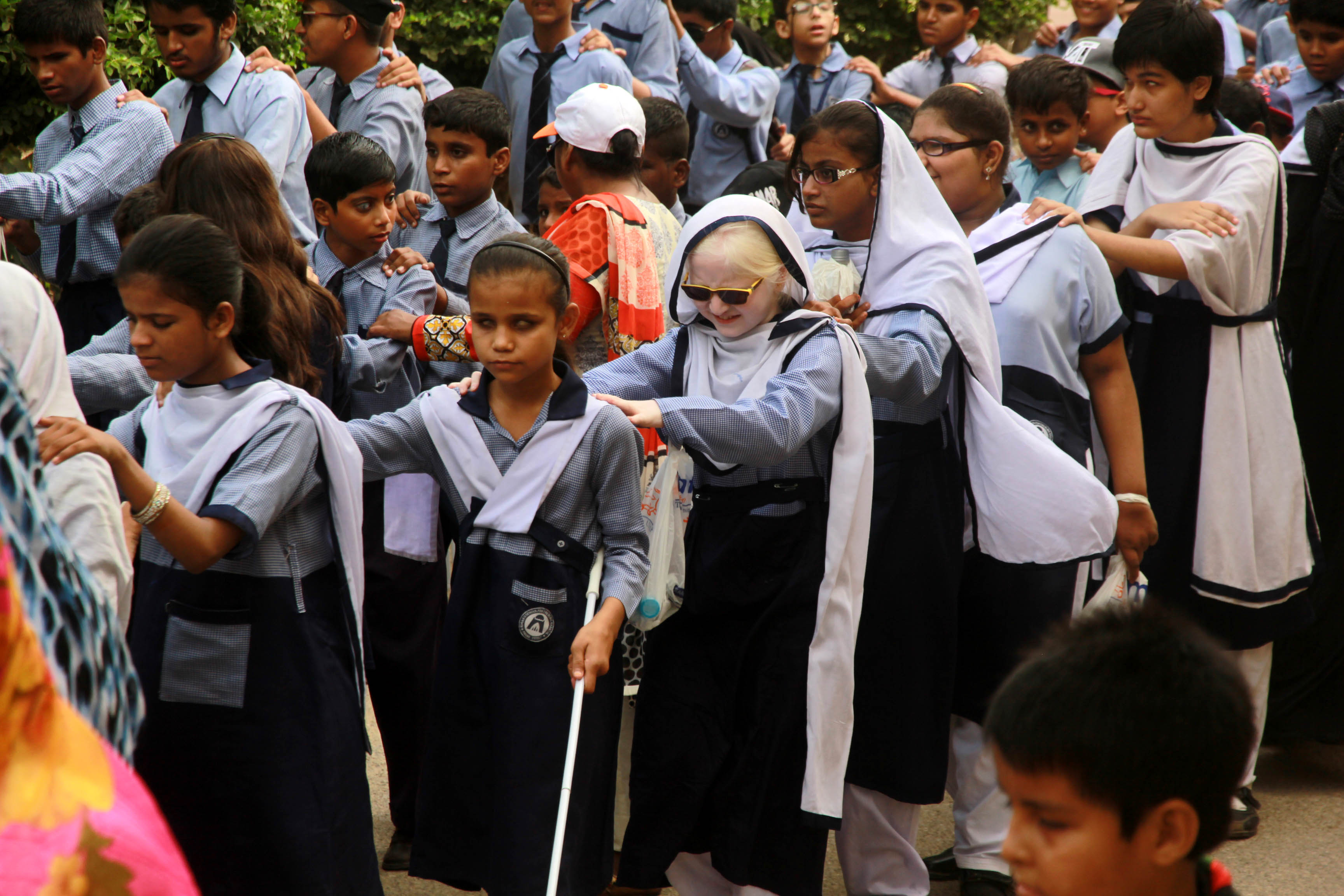 children from ida rieu school took part in the walk to raise awareness about the visually impaired photo athar khan express