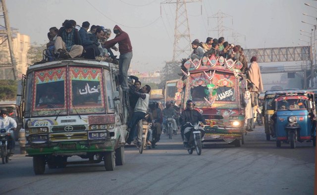 due to the chronic lack of public transport passengers are often forced to climb atop buses photo file