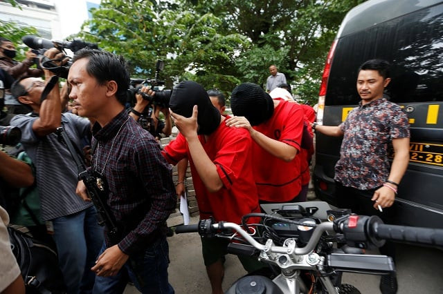 men detained during a raid on a 039 gay 039 spa in jakarta are escorted by plainclothes policemen photo reuters men detained during a raid on a 039 gay 039 spa in jakarta are escorted by plainclothes policemen photo reuters