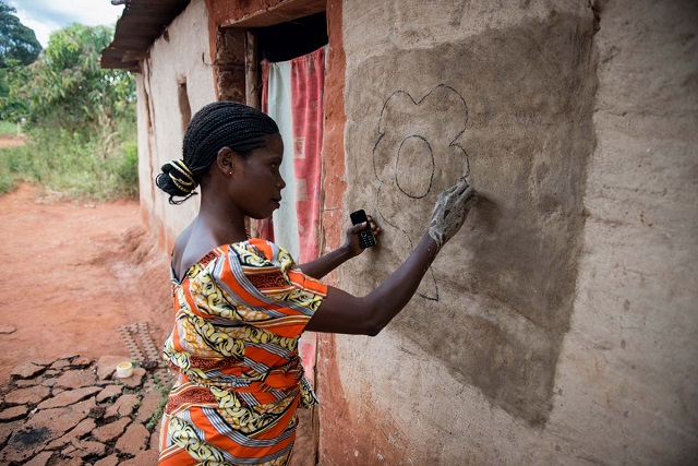 representative image a woman painting a hut in makwatsha dr congo may 13 2017 photo afp