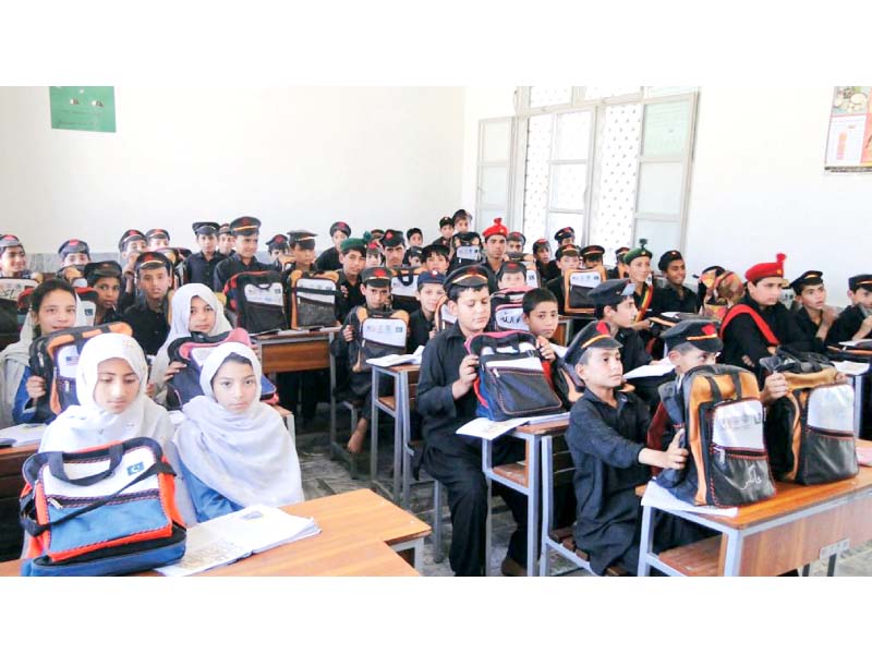 students attend class in a renovated school in swat photo file