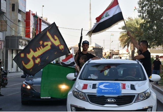 people celebrate on the streets as iraqi forces retake kirkuk from kurd forces photo afp people celebrate on the streets as iraqi forces retake kirkuk from kurd forces photo afp