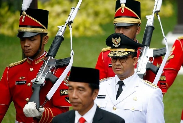 presidential guards walk with l r indonesia president joko widodo and jakarta governor anies baswedan for a swearing in ceremony at the presidential palace in jakarta indonesia october 16 2017 photo reuters beawiharta presidential guards walk with l r indonesia president joko widodo and jakarta governor anies baswedan for a swearing in ceremony at the presidential palace in jakarta indonesia october 16 2017 photo reuters beawiharta