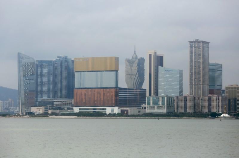 mgm macau in three colours and grand lisboa c casinos are seen in macau photo reuters