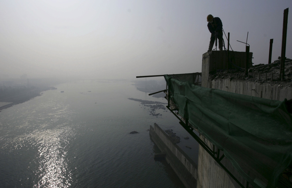 a labourer works on a reservoir photo reuters