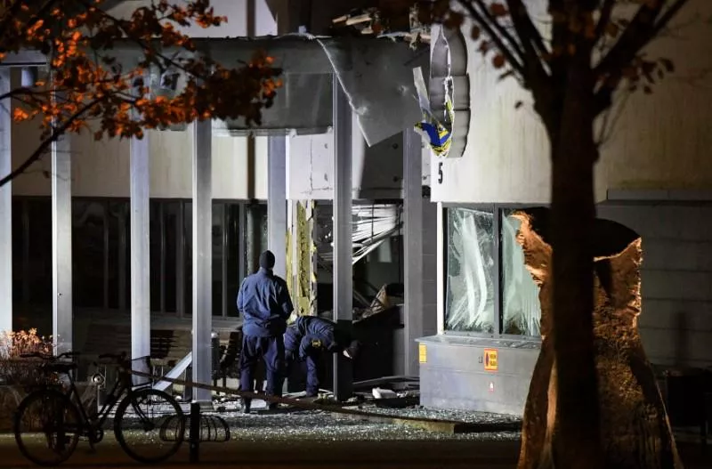 police forensics work at the scene after a powerful explosion at the main entrance to the police station in helsingborg sweden october 18 photo reuters police forensics work at the scene after a powerful explosion at the main entrance to the police station in helsingborg sweden october 18 photo reuters