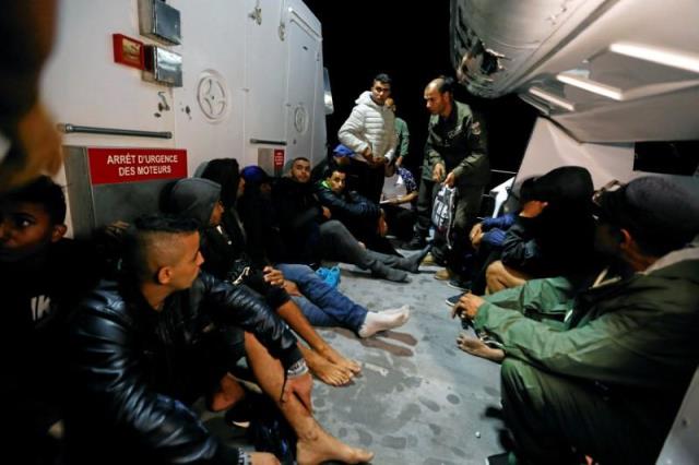 migrants are seen on a boat after they were rescued by tunisian coast guard off the coast of bizerte tunisia october 12 2017 photo reuters