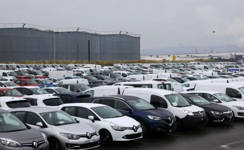 rows cars and vans parked outside a automobile plant photo reuters rows cars and vans parked outside a automobile plant photo reuters