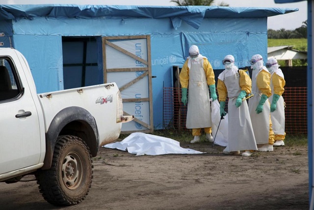 health workers wearing head to toe protective gear prepare for work outside an isolation unit in foya district lofa county liberia in this july 2014 unicef handout photo handout via reuters