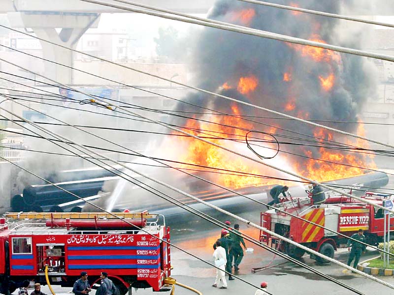 firefighters trying to control the fire that erupted in sewerage pipes photo online