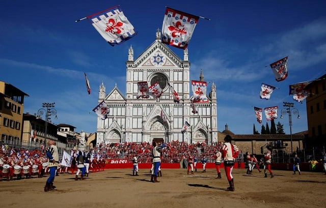 file photo flag wavers perform in santa croce square before the calcio fiorentino historic football semifinal match between rossi red santa maria novella against verdi green san giovanni in florence italy june 10 2017 reuters alessandro bianchi file photo file photo flag wavers perform in santa croce square before the calcio fiorentino historic football semifinal match between rossi red santa maria novella against verdi green san giovanni in florence italy june 10 2017 reuters alessandro bianchi file photo