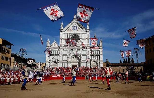 file photo flag wavers perform in santa croce square before the calcio fiorentino historic football semifinal match between rossi red santa maria novella against verdi green san giovanni in florence italy june 10 2017 reuters alessandro bianchi file photo file photo flag wavers perform in santa croce square before the calcio fiorentino historic football semifinal match between rossi red santa maria novella against verdi green san giovanni in florence italy june 10 2017 reuters alessandro bianchi file photo