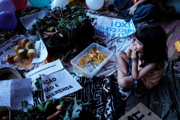 a child eats an orange next to a sign reading quot food pellets are not meals quot during a protest against sao paulo mayor doria 039 s plans to serve school meals made of reprocessed food pellets in sao paulo brazil oct 19 2017   reuters