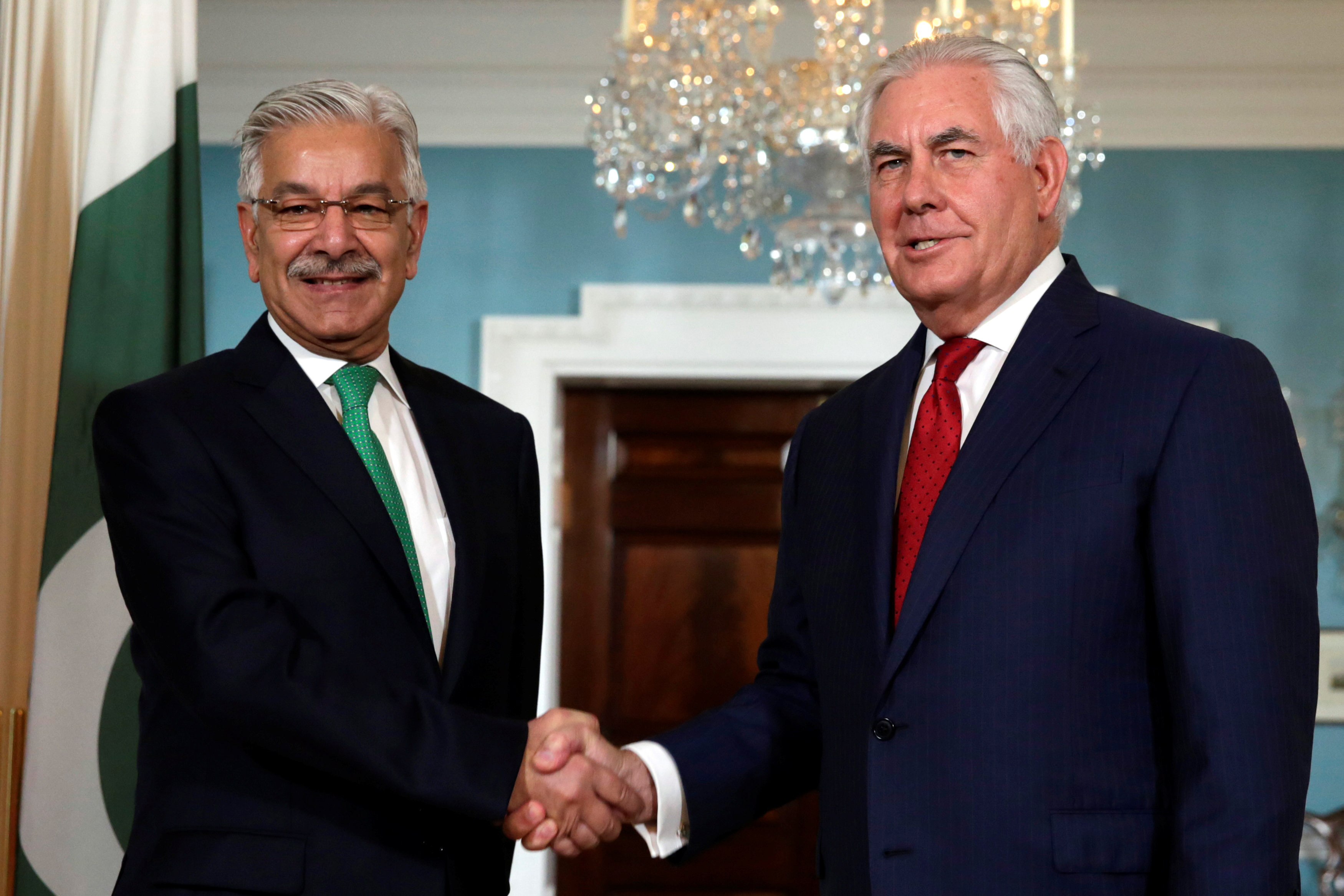 u s secretary of state rex tillerson r shakes hands with foreign minister khawaja asif before their meeting at the state department in washington u s october 4 2017 photo reuters