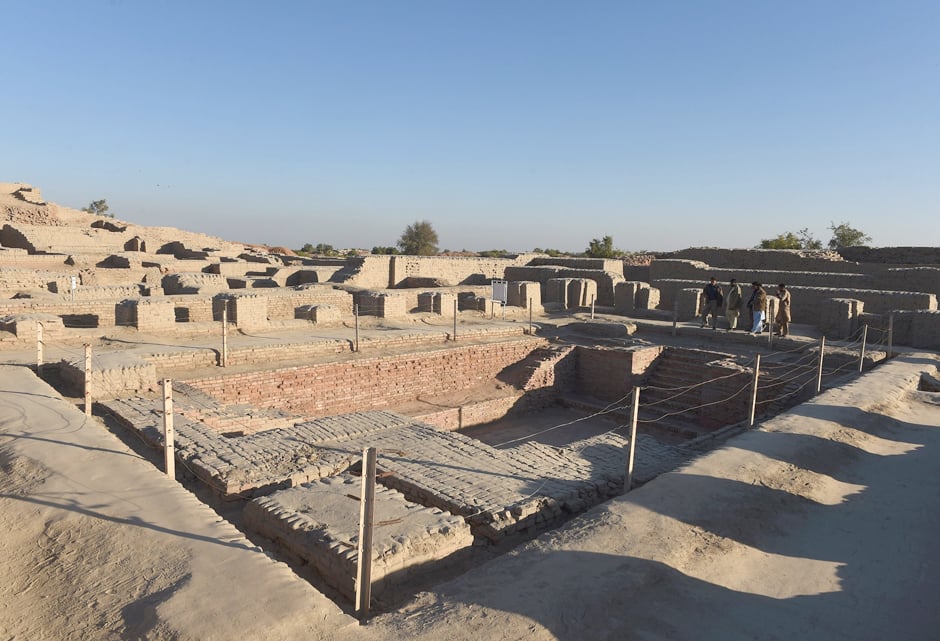 in this photograph taken on february 9 2017 visitors walk through the unesco world heritage archeological site of mohenjo daro some 425 kms north of the pakistani city of karachi once the centre of a powerful civilisation mohenjo daro was one of the world 039 s earliest cities    a bronze age metropolis boasting flush toilets and a water and waste system to rival modern standards some 5 000 years on archaeologists believe the ruins could unlock the secrets of the indus valley people who flourished around 3 000 bc in what is now india and pakistan before mysteriously disappearing photo afp