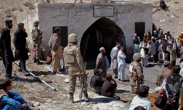 pakistan army soldiers mine workers and local residents gather outside a coal mine ap photo