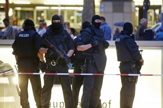 special force police officers stand guard at an entrance of the main train station in munich photo reuters