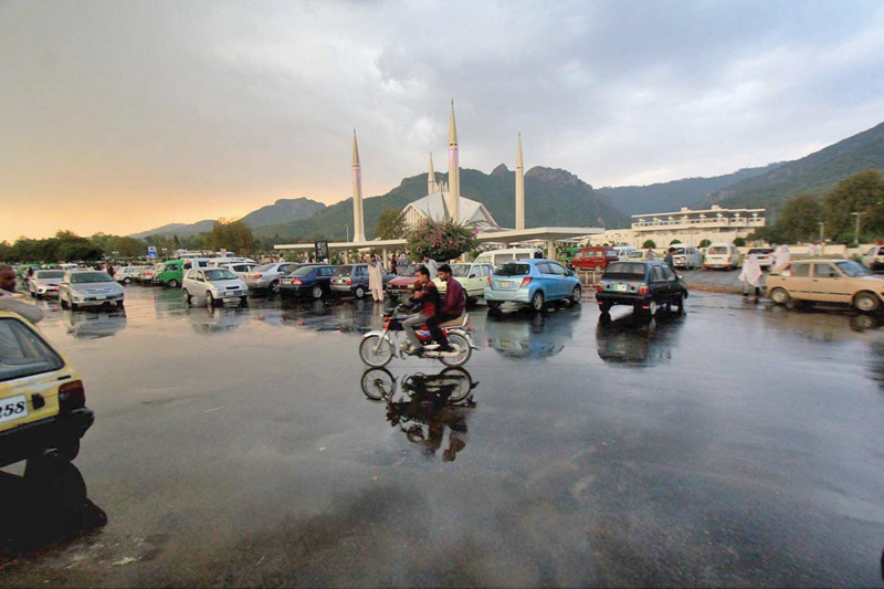 a pleasant look of the capital after a rain spell with shah faisal mosque in the foreground photo online