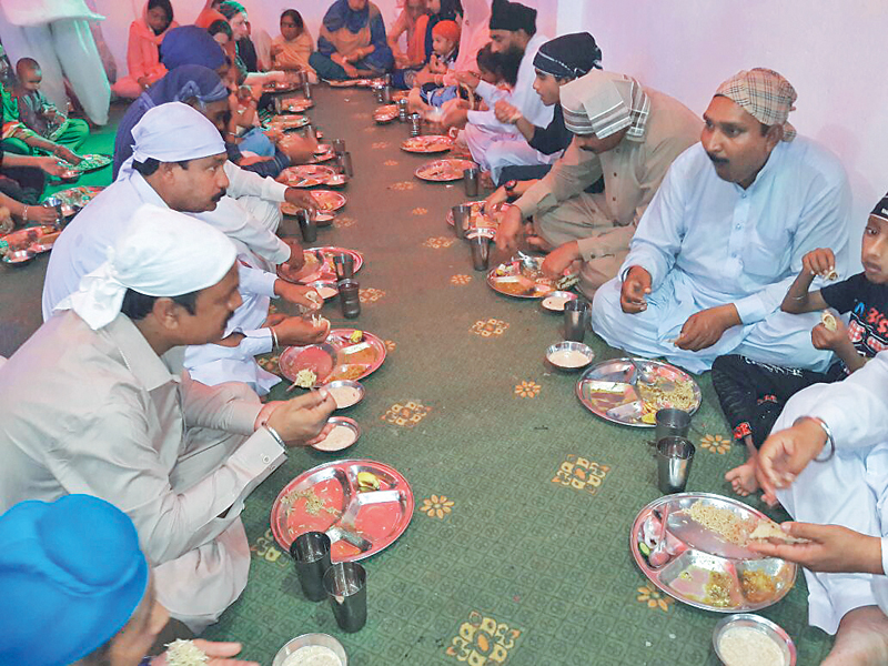 sikh devotees mark the 549th birthday of guru nanak in peshawar photos express