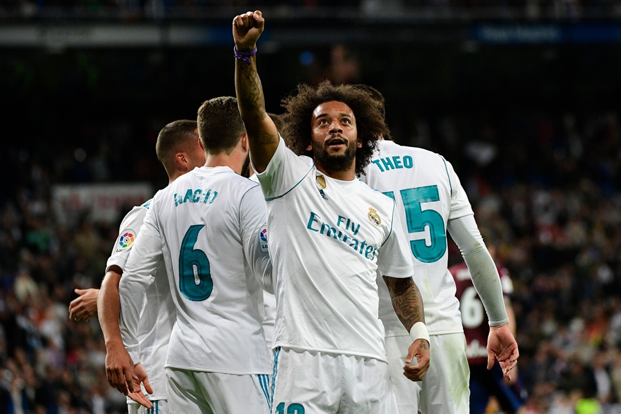 real madrid 039 s brazilian defender marcelo celebrates after scoring his team 039 s third goal during the spanish league football match real madrid cf vs sd eibar at the santiago bernabeu stadium in madrid on october 22 2017 photo afp