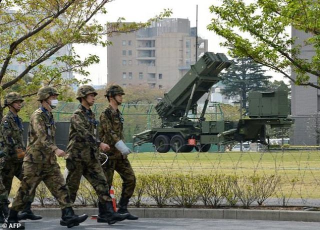 abe wants to change the constitution to specifically mention the country 039 s military photo afp