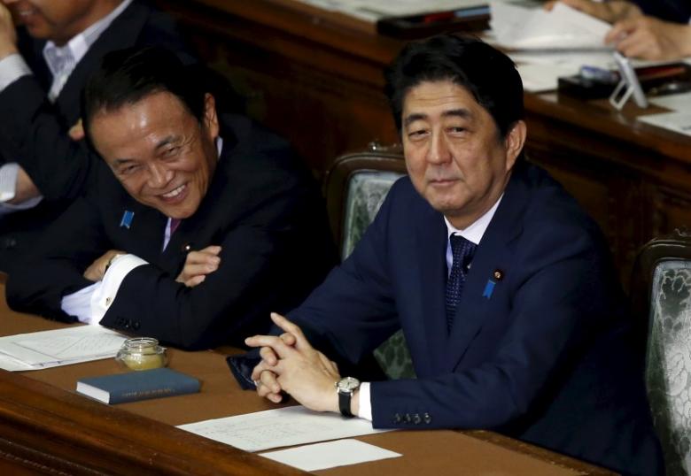 japan 039 s prime minister shinzo abe smiles with dpm and finance minister aso during the plenary session for his cabinet 039 s censure motion at at the lower house of the parliament in tokyo photo reuters