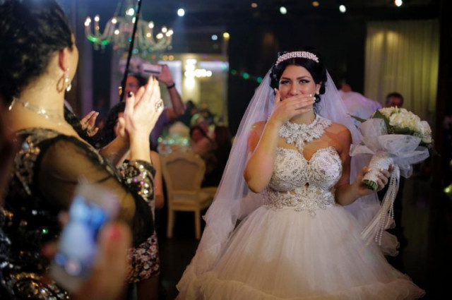 israeli bride morel malcha walked down the aisle with israeli arab groom mahmud mansur in august 2014 to racist chants by extremists opposed to the marriage of a jew and a muslim photo afp israeli bride morel malcha walked down the aisle with israeli arab groom mahmud mansur in august 2014 to racist chants by extremists opposed to the marriage of a jew and a muslim photo afp