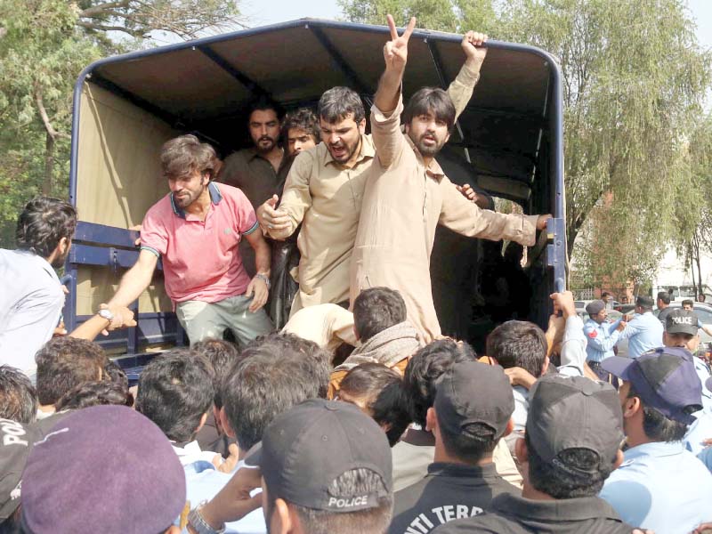 islamabad police haul away protesting students from qau photo express agencies