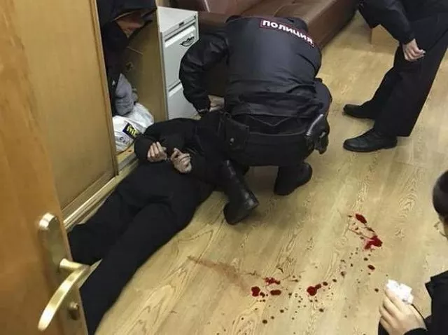 policemen detain an intruder who attacked russian journalist tatyana felgengauer in moscow russia photo reuters