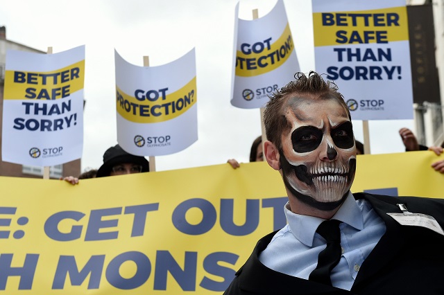 a man with make up depicting a skeleton and people brandishing panels take part in a a protest march on october 25 2017 in brussels and organised by stop glyphosate coalition the group of citizens organisations from across europe who have led the successful european citizen 039 s initiative calling for glyphosate to be banned photo afp