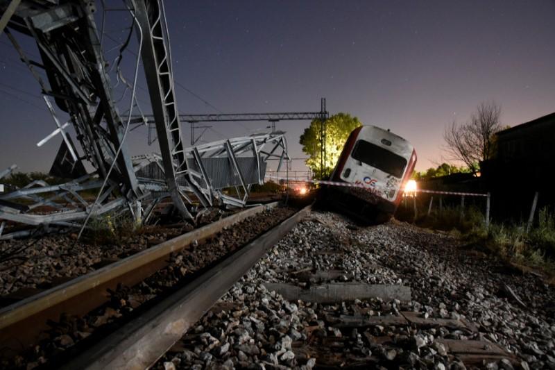 a derailed train carriage is seen toppled photo reuters