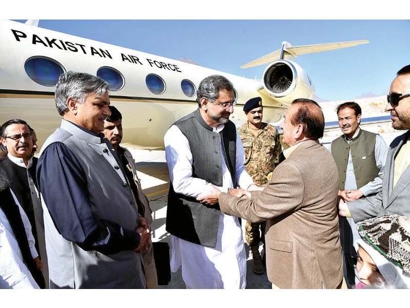 prime minister shahid khaqan abbasi being warmly received by gilgit baltistan governor mir ghazanfar ali on arrival in skardu photo app