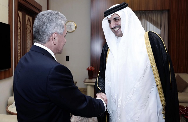 a handout picture released by the qatar news agency on october 25 2017 shows emir sheikh tamim bin hamad al thani r receiving russian minister of defence sergei shoigu in doha photo afp