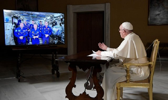 pope francis chats with six astronauts during a video conference with the international space station at the vatican photo afp pope francis chats with six astronauts during a video conference with the international space station at the vatican photo afp