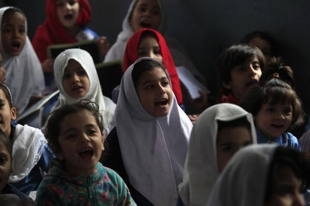 girls recite their lesson while attending their daily class at a government school in peshawar on october 29 2014 photo reuters girls recite their lesson while attending their daily class at a government school in peshawar on october 29 2014 photo reuters