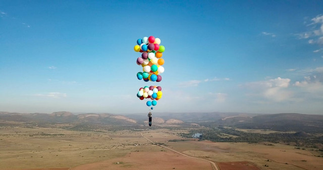 tom morgan from bristol based company the adventurists flies in a chair with large party balloons tied to it near johannesburg south africa photo reuters