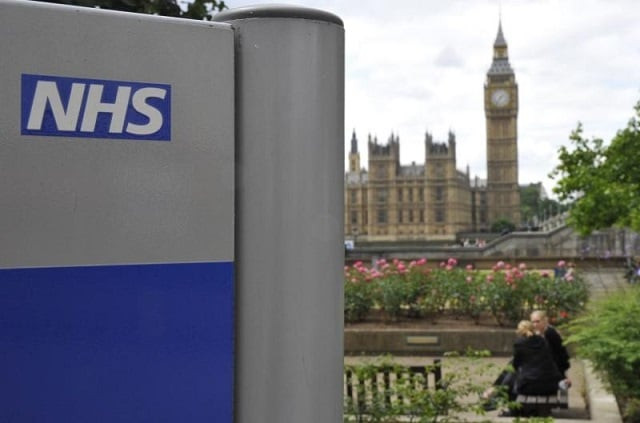 a national health service nhs sign is seen in the grounds of st thomas 039 hospital in front of the houses of parliament in london june 7 2011 photo reuters