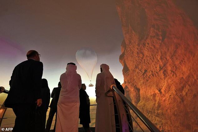 participants watch images promoting saudi arabia 039 s red sea project at the future investment initiatives conference in riyadh photo afp