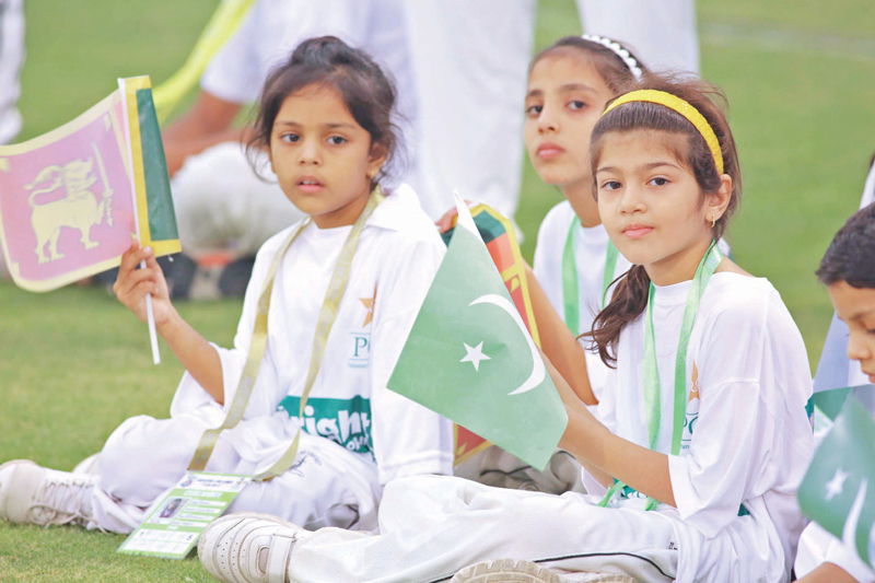 children wave flags of pakistan and sri lanka during the final t20 match photo malik shafiq express