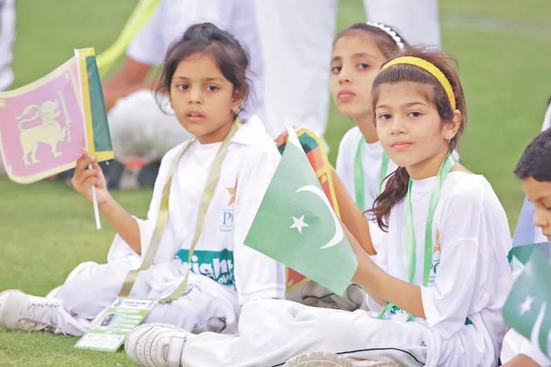 children wave flags of pakistan and sri lanka during the final t20 match photo malik shafiq express children wave flags of pakistan and sri lanka during the final t20 match photo malik shafiq express