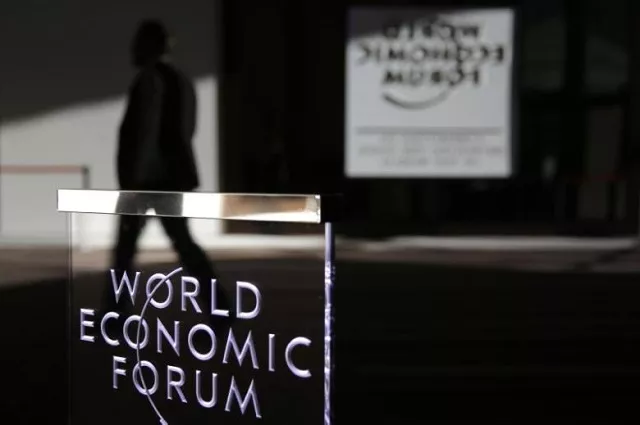 a man passes a logo during the annual meeting of the world economic forum wef in davos switzerland january 22 2016 photo reuters a man passes a logo during the annual meeting of the world economic forum wef in davos switzerland january 22 2016 photo reuters