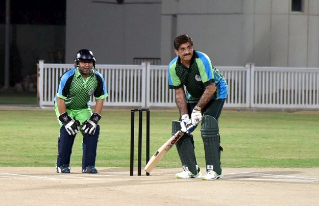 sindh chief minister syed murad ali shah bats during sindh and punjab parliamentarians match organised at moin khan stadium photo express