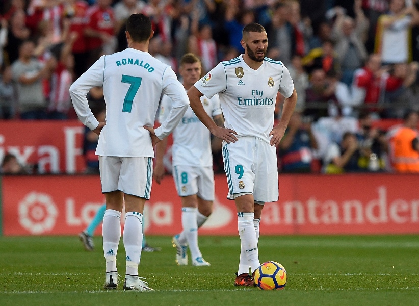 real madrid 039 s portuguese forward cristiano ronaldo l and real madrid 039 s french forward karim benzema stand on the field after girona 039 s goal during the spanish league football match girona fc vs real madrid cf at the municipal de montilivi stadium in girona on october 29 2017 photo afp