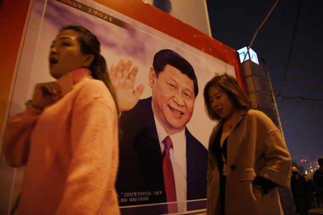 a roadside poster of xi jinping now he has a new honorific photo afp a roadside poster of xi jinping now he has a new honorific photo afp