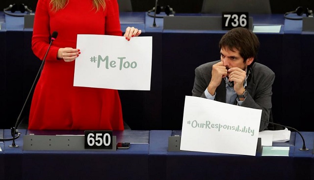 european parliament member terry reintke l holds a placard with the hashtag quot metoo quot during a debate to discuss preventive measures against sexual harassment and abuse in the eu at the european parliament in strasbourg france october 25 2017 reuters christian hartmann